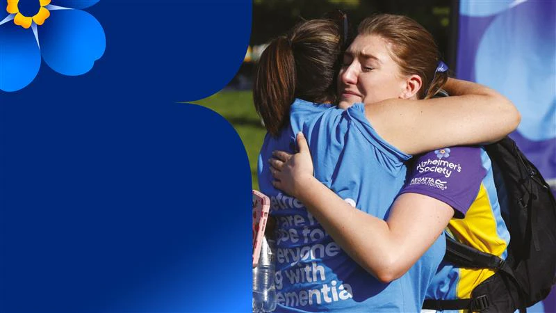 Two people embracing, one of them from Alzheimer's Society