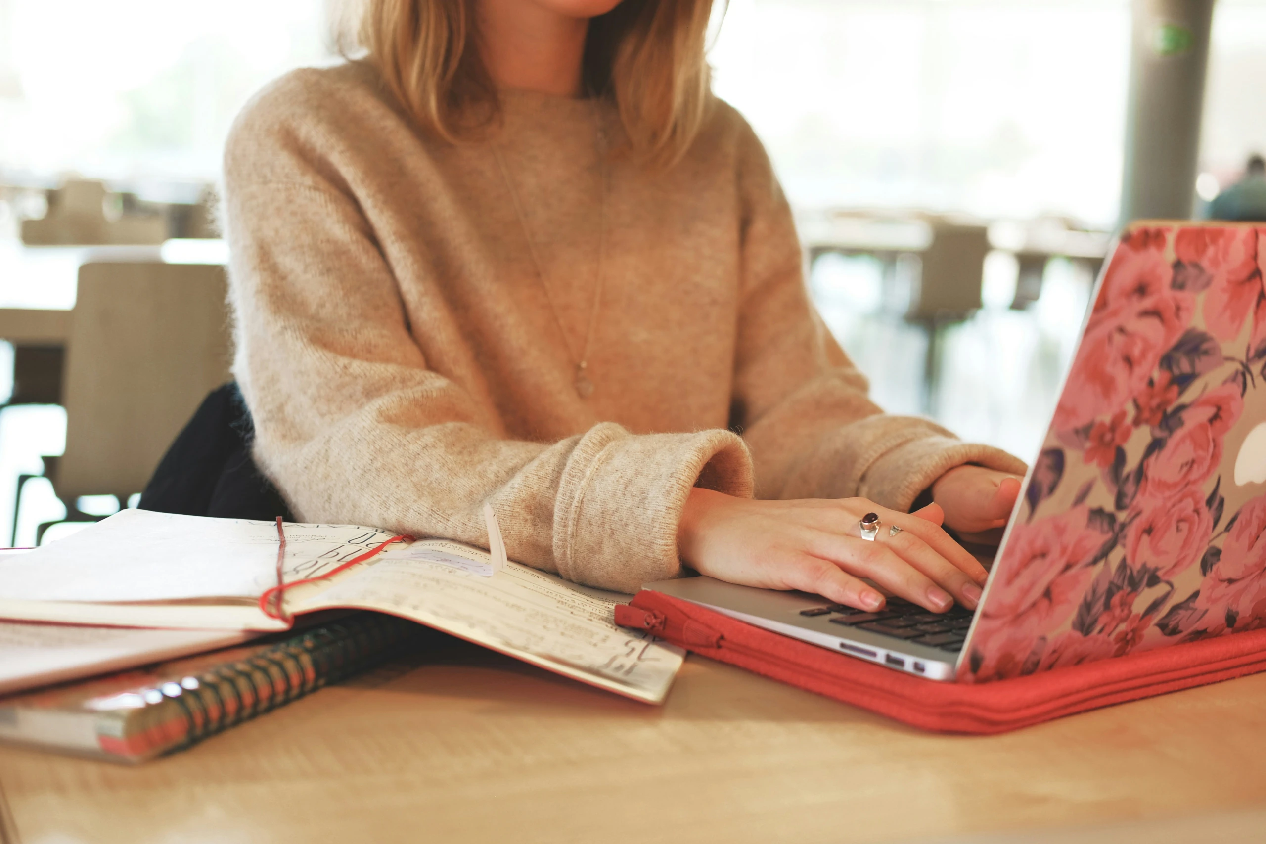 Person working on laptop at table